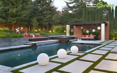 an outdoor living area with grass and white balls on the ground next to a pool