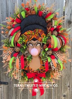 a wreath with an image of a woman's face on it