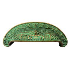 an ornate green drawer pull handle on a white background with clipping for text or image