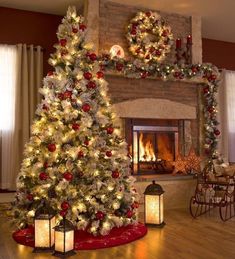 a decorated christmas tree in front of a fireplace