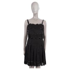 100% authentic Chanel cocktail dress in black silk (100%) with lace details. Closes with zipper and buttons and bow on the back. Lined in silk (100%). Has been worn and is in excellent condition. 2006 Spring/Summer Measurements Model 06P P28237 V02124 Tag Size 38 Size S Bust 86cm (33.5in) to 86cm (33.5in) Waist 66cm (25.7in) to 66cm (25.7in) Hips 86cm (33.5in) to 86cm (33.5in) Length 69cm (26.9in) Side Seam Length 76cm (29.6in) All our listings include only the listed item unless otherwise specified in the description above. Layered Cocktails, Chanel Black, Vintage Chanel, Black Silk, Lace Detail, Day Dresses, Lace Trim, Casual Dresses, Cocktail Dress