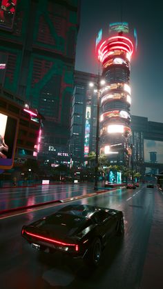 a futuristic city at night with neon lights and cars driving down the street in front of tall buildings