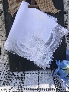 This antique handkerchief has gorgeous lace, a piece of frosted sea glass and a hand embroidered blue french dot. Something old, something blue. A unique gift for any occasion but especially for a bride to carry to fulfill the Victorian tradition of "something olde and something blue" to bring luck to her marriage. Elegant Lace Work Handkerchiefs Gift, White Handmade Handkerchief As Gift, Handmade White Handkerchiefs For Gift, Vintage Lace Trim Handkerchiefs As Gift, Vintage Handkerchiefs With Lace Trim For Gift, Handmade White Wedding Handkerchiefs, Vintage Handmade Wedding Handkerchiefs, Handmade Vintage Handkerchiefs As Gift, Vintage Handmade Handkerchiefs As Gifts