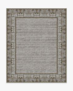 a rug with an ornate border in grey and beige colors, on a white background