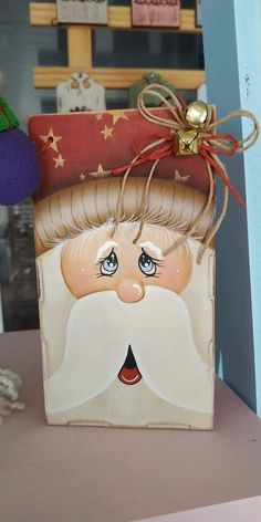 a small box with a santa claus face on it