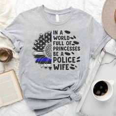 Looking for a way to show your support for law enforcement? Check out our comfortable and stylish Police Wife shirt! This shirt is perfect for police wives and features the slogan “In A World Full of Princesses Be A Police Wife” on the front. Whether you’re shopping at the mall or just hanging out with friends, this shirt is sure to show your support for law enforcement! Support Law Enforcement Shirts, Police Academy Graduation Party, Law Enforcement Shirts, Wife Life Shirt, Police Academy Graduation Gift, Law Enforcement Wife, Shopping At The Mall, Police Girlfriend, Police Wife Shirt