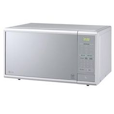 a silver microwave oven sitting on top of a white counter