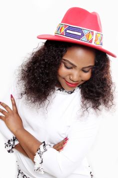 Embellished Women Fedora Hat with Ndebele beads available in various colours. Very stylish with an African touch. Festival Beaded Fedora With Flat Brim, Wide Brim Beaded Fedora For Festival, Beaded Wide Brim Fedora For Festivals, Festival Fedora Hat With Beads, Red Fedora Hat For Festivals, Beaded Fedora Hat For Festivals, Festival Beaded Fedora Hat, Beaded Hat With Curved Brim, Red Beaded Festival Hat