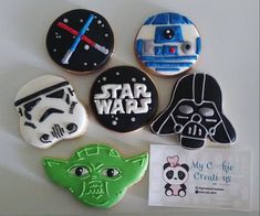 star wars decorated cookies are displayed on a white surface with stickers and magnets