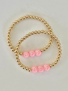 This listing is for a set of 2 children's bracelets | 4mm 14K Gold-Filled beads strung on elastic stretch cord, accented with acrylic letter beads that spell out BFF. Choose your letter bead color. Bracelet is elastic, measuring at 5.5 inches, which is an average wrist size for children ages 3-7. Use adult supervision while child is wearing bracelet. Beads are a choking hazard. Bff Bracelets For 2 Diy, Cute Gold Stretch Bracelet With Letter Beads, Best Friend Bracelets For 2, Bff Bracelets For 2, Bestie Bracelets, Bracelet Best Friends, Bracelets Bff, Bff Bracelet, Letter Bead Bracelets