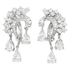 The earrings are finely crafted in platinum and with pear baguette and round cut of diamonds weighing approximately total of 10.00 carat. Harry Winston Earrings, Pear Diamond Earrings, White Diamond Earrings, Vintage Drop Earrings, Diamonds Earrings, Diamond Earrings Design, Cocktail Earrings, Platinum Earrings, Earrings Design