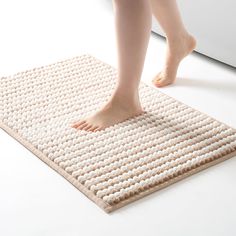 a person standing on top of a mat