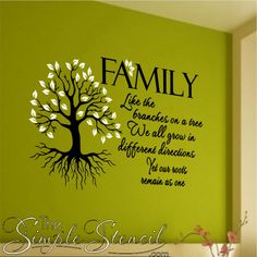 the family tree wall decal is painted in green and black with white leaves on it