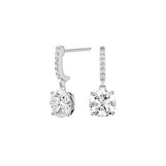 Add length and brilliance with these solitaire drop earrings. Each 1 carat stone drops from a radiant line of additional pavé lab-grown diamonds. Loose Stones, 1 Carat, Egift Card, Round Brilliant, Lab Grown, Lab Grown Diamonds, Light Box, Lab, Diamonds