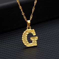 This uppercase initial necklace is perfect for a meaningful gift to someone special or for yourself, a dainty letter surely to be a beautiful accent piece to any occasion! Product Description♥ Material: Stainless Steel/ Gold plated♥ Chain Type: Water-wave Chain♥ Pendant Size: 14 cm (0.55'') Shipping Time♥ USA > 4-10 business days♥ International > 2-3 weeks Name Choker, Initial Letter Necklace, Birthday Pendant, Alphabet Pendant, Gold Letter Necklace, Birthday Jewelry, Initial Pendant Necklace, Pretty Necklaces, Gold Initial