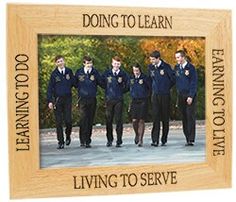 a wooden photo frame with the words doing to learn living to serve