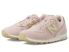 New Balance Classics 996 - Women's Classic Shoes : Pink Sand/Gold : A modern take on an iconic silhouette, the New Balance Classics sneakers pair sleek colorways with a slim profile and reliable comfort. Casual shoes with a sporty, cushioned silhouette. Suede and mesh uppers for durable, breathable wear. Lace-up closure. Dual-density EVA midsole offers exceptional cushioning and stability. Rubber outsole provides traction and lasting durability. Imported. Measurements: Weight: 9.2 oz Product mea Comfortable Mesh Sneakers With Air Max Cushioning, Athletic Fit Low-top Sneakers With Air Max Cushioning, Sporty Spring Sneakers With Cushioned Footbed, Pink Low-top Walking Shoes For Athleisure, Pink Low-top Walking Shoes Athleisure Style, Comfortable Sneakers For Jogging With Perforated Toe Box, Comfortable Jogging Sneakers With Perforated Toe Box, Pink Low-top Walking Shoes With Air Max Cushioning, Athleisure High-top Walking Shoes With Air Max Cushioning