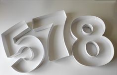 the numbers are made out of white paper