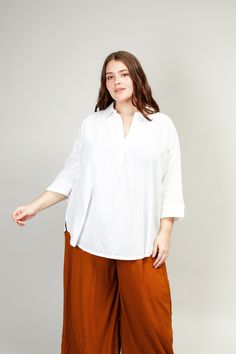 Meet the perfect white top. The White Breezy Tunic is crafted from soft, breathable cotton with the perfect amount of structure and flow. The easy silhouette looks great tucked into a skirt or worn loose for a free-spirited feel. Mercedes is 5’8”, wearing size 1. She is typically size 4/6, S. Ali is 5’10”, wearing size 2. She is typically size 14, M/L. Khay is 5’8”, wearing size 1. She is typically size 2/4, XS/S. Tegan is 5’6”, wearing size 3. She is typically size 14/16, L/XL. Breezy Tops With Relaxed Fit For Daywear, Breezy Relaxed Fit Tops For Daywear, Versatile White Blouse With Shirttail Hem, White Relaxed Fit Breezy Tops, Chic Cotton Tunic With Relaxed Fit, Effortless White Blouse For Daywear, Breezy Relaxed Fit Cotton Tops, White Beach Top With Shirttail Hem, Relaxed Fit Breezy Cotton Top