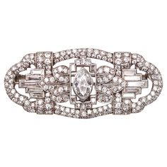 An art deco convertible pendant brooch with GIA certified diamond. An statement piece, created during the American Art Deco period, back in the 1930. This beautiful convertible pendant-brooch, was carefully crafted with geometric patterns in solid .900/.999 platinum. The back of this brooch is fitted with a hinge bar which is removable by means of a screw, and the top with a retractable shackle to be worn as a necklace pendant on a chain. It is embellished with a great selection of natural earth Art Deco White Gold Brooch In Platinum, Art Deco Platinum Brooches In White Gold, Art Deco White Gold Platinum Brooches, Classic Platinum Brooch With Brilliant Cut, Art Deco Platinum Brooch For Formal Occasions, Art Deco White Gold Diamond Brooch, Platinum Art Deco Brooch For Formal Occasions, Formal Art Deco Platinum Brooches, Art Deco Diamond Brooch For Evening