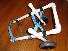 a white and blue pipe holder on top of a wooden floor