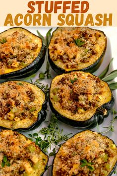 baked stuffed acorn squash with herbs and seasoning in the middle on a white plate