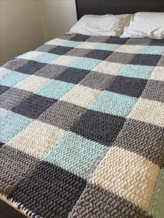 a bed with a blanket on top of it