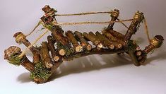 a wooden bench made out of logs and branches