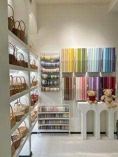 a store with shelves filled with lots of different colored items