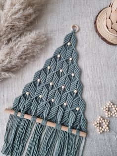 a close up of a piece of yarn on a table with beads and other items