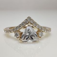 a diamond ring with diamonds surrounding it