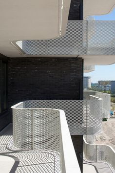 some white metal railings on the side of a building