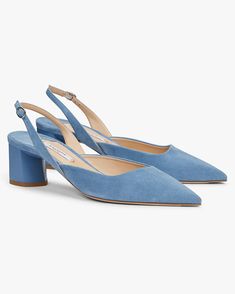 a pair of blue shoes with straps on the side and heeled heels at the bottom