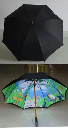 two umbrellas side by side with the same design on them, one black and one green