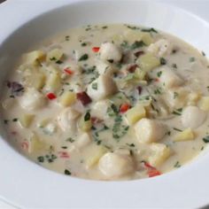 a white bowl filled with soup on top of a table