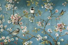 two birds are sitting on the branch of a blossoming tree