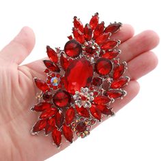 "Gorgeous large red rhinestone brooch in silver tone setting, which can be used for your DIY project - Red wedding, cake and frame decoration, dress sash decoration, crafts, scrap booking, jewelry gift and much more.  Size: 4 1/4\"H x 2 1/2\"W Stones color: red, dark red Metal: silver plated This chunky crystal brooch can be ordered with pin in the back to wire into brooch bouquet, add to gown or dress sash, or any number of other craft projects or without the pin as a flat back embellishment for your sew-on, glue-on DIY project. More RED brooches - https://www.etsy.com/shop/Crystalitzy?section_id=19893739 Please note that this crystal rhinestone embellishment has flat backing, it is suitable only for your sew-on or glue-on DIY project however if you prefer to have it with pin so you can u Elegant Red Brooches As Gifts, Red Rhinestone Brooches For Wedding, Handmade Red Wedding Brooches, Formal Red Rhinestone Brooch, Elegant Red Brooch Pins, Project Red, Wedding Brooch Bouquets, Dress Pin, Brooch Bouquet