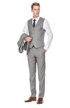 Bring understated elegance to the table in this three-piece suit crafted from rich fabric in a classic single-breasted silhouette. Jacket has notched lapels; chest welt pocket; front flap pockets Vest has front button closure; V-neck Pants have zip fly with button closure; front slant pockets; back button-welt pockets Jacket and vest are lined; trousers are lined to the knee 65% polyester, 35% viscose Dry clean Imported Each suit has a 6” drop, meaning that a size 38R jacket is paired with size Semi-formal Slim Fit Single Breasted Three-piece Suit, Slim Fit Three-piece Suit With Suiting Fabric, Professional Three-piece Slim Fit Suit, Slim Fit Professional Three-piece Suit, Professional Slim Fit Three-piece Suit, Semi-formal Slim Fit Three-piece Suit With Single Button, Professional Single Breasted Three-piece Suit For Semi-formal Occasions, Slim Fit Single Button Suiting Sets, Professional Single Breasted Suiting Fabric Sets