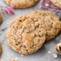 two oatmeal cookies sitting on top of a table