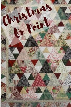 a quilt with the words christmas on point written in red and green letters above it