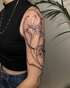 a woman with a tattoo on her arm