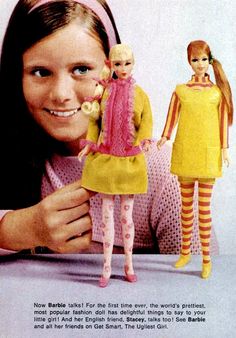 an advertisement for barbie dolls with a girl holding a doll