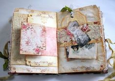 an open book with pictures and flowers on it