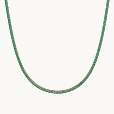 The Evergreen Tennis Necklace from our Eden Collection embodies the radiant beauty of the Garden of Eden. Available in widths of 1.70 mm and 3 mm and lengths of 35 cm and 40 cm, this necklace is adorned all around with sparkling emeralds set in 14kt recycled gold. The emeralds shine in an intense green and have been meticulously set by hand to enhance their natural brilliance. The Evergreen Tennis Necklace is a timeless piece of jewelry that adds a special touch to any outfit and stands out with Elegant Green Round Chain Necklace, Elegant Green Jewelry With Box Chain, Elegant Green Tennis Necklace With 17 Jewels, Classic Green Necklace For May Birthstone, Elegant Green Tennis Necklace, Classic Green Single Strand Necklace, Green Single Strand Emerald Necklace For May Birthstone, Green Single Strand Necklace For May Birthstone, Elegant Green Tennis Necklace As A Gift