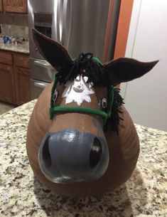 the head of a horse is made out of clay