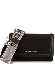 From Michael Kors&#x2C; this crossbody bag features:Our Jet Set smartphone crossbody bag is a small wonder. It’s constructed from durable nylon with polished hardware for a luxe finish&#x2C; while a back-snap pocket opens to a discreet compartment to safely store your phone. Wear it hands-free by the woven strap on days when you want to travel light.Nylon Rhodium-plated hardwareFlap with magnetic snap closure Interior: 2 back slip pockets&& Travel Shoulder Bag With Logo Strap, Michael Kors Shoulder Bag With Mobile Phone Bag, Michael Kors Crossbody Mobile Phone Bag, Michael Kors Crossbody Shoulder Bag With Logo Hardware, Michael Kors Black Crossbody Bag, Michael Kors Black Bag With Zipper Closure, Michael Kors Jet Set Crossbody Bag, Small Wonder, Travel Light