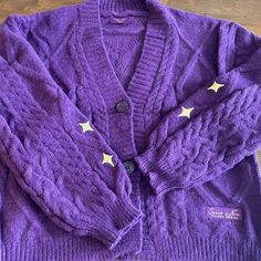 Size Medium/Large. Never Worn, Mint Condition. Comes With Included Purple Heart Confetti!! No Pets, No Smoking. Original Packaging. Purple Long Sleeve Cable Knit Cardigan, Long Sleeve Purple Cable Knit Cardigan, Casual Purple Cable Knit Cardigan, Trendy Purple Cotton Cardigan, Speak Now Cardigan, Taylor Swift Purple, Gold Cardigan, Taylor Swift Speak Now, Heart Confetti