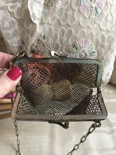 "Darling and perfect small German silver metal mesh purse for a bride or a special night or for the lady who collects little treasures. The silver frame at the top, front and back, has delicate etching detail. Inside the frame is the hallmark HHCCO GERMAN SILVER. Frame is hinged at sides. The little silver pieces are attached at the top on both sides. At the bottom there are 5 little dangles. The chain handle is made of elongated links. I don't know which parts of the bag are sterling or if the Silver Metal Evening Bag As Gift, Vintage Handmade Silver Bag, Vintage Silver Handmade Bag, Handmade Victorian Style Silver Bags, Antique Silver Bags For Vintage Events, Vintage Silver Rectangular Coin Purse, Antique Handmade Evening Bag For Gift, Antique Handmade Evening Bag As Gift, Handmade Antique Evening Bag For Gifts