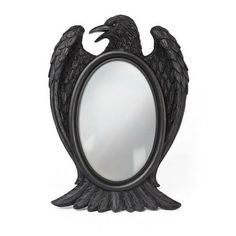 a mirror with an eagle design on the front and sides, sitting in front of a white background