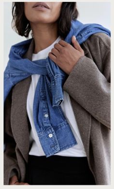 a woman wearing a blue scarf around her neck